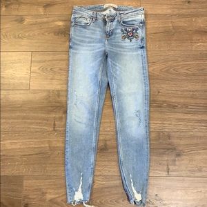 Denim jeans with floral decal